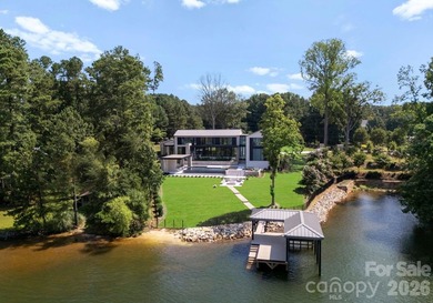 Private by design. Defined by the lake. Behind private gates and - photo 48