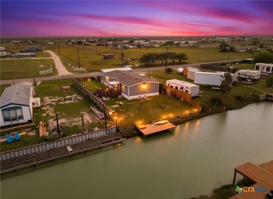 Canal-front turnkey coastal retreat with private fishing dock - photo 1