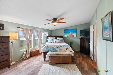 Canal-front turnkey coastal retreat with private fishing dock - photo 7