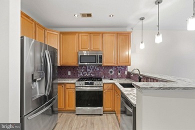 Stunning top-floor 2BR condo with elevator access and serene - photo 11
