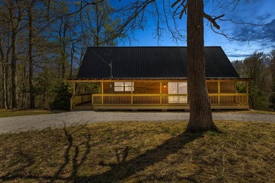 Tucked away among the trees and just minutes from Cave Run Lake - photo 2
