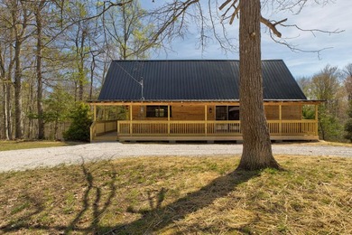 Tucked away among the trees and just minutes from Cave Run Lake - photo 3