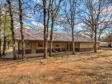 Tucked away on 5 secluded, gated acres, this beautifully crafted