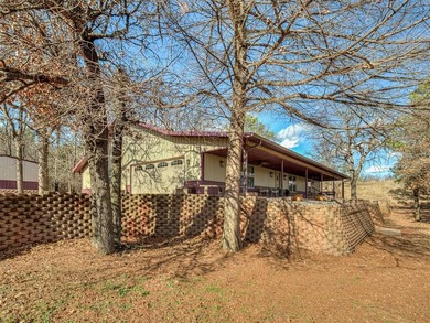 Tucked away on 5 secluded, gated acres, this beautifully crafted