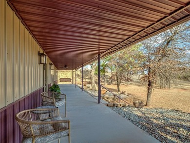 Tucked away on 5 secluded, gated acres, this beautifully crafted