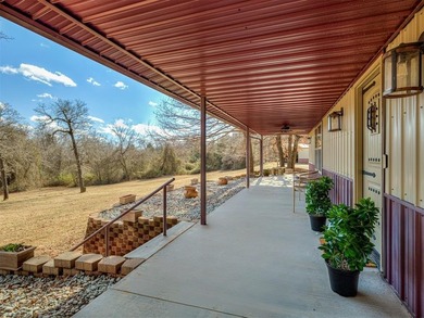 Tucked away on 5 secluded, gated acres, this beautifully crafted