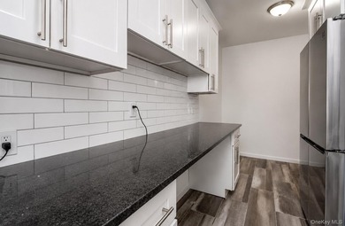 Welcome to this beautifully renovated, sun-filled corner - photo 12