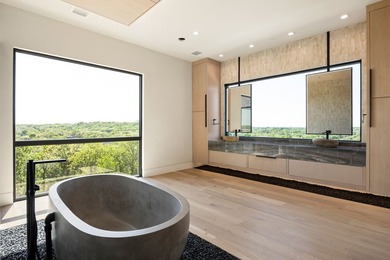 Rising above the forest canopy on nearly 9 secluded acres - photo 34