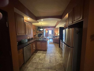 Located on the sixth floor, this spacious three bedroom condo - photo 5
