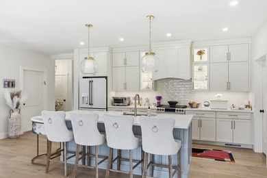 Welcome to a showpiece in Rindge-an almost-new custom farmhouse - photo 4