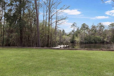 Set along 99 feet of watererfront, this updated brick home - photo 36