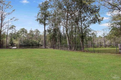 Set along 99 feet of watererfront, this updated brick home - photo 37