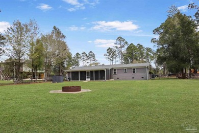 Set along 99 feet of watererfront, this updated brick home - photo 39