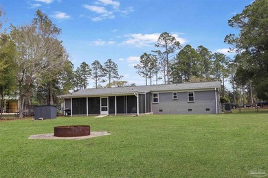 Set along 99 feet of watererfront, this updated brick home - photo 41