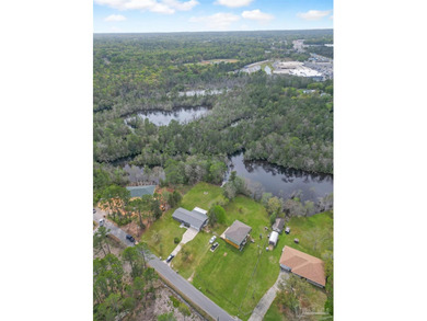 Set along 99 feet of watererfront, this updated brick home - photo 45