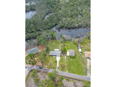 Set along 99 feet of watererfront, this updated brick home - photo 46