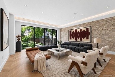 A fully renovated two-family townhouse spanning approximately 3 - photo 1