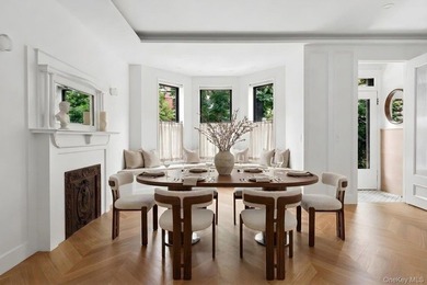 A fully renovated two-family townhouse spanning approximately 3 - photo 2