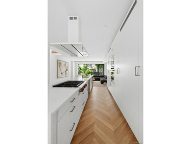 A fully renovated two-family townhouse spanning approximately 3 - photo 4