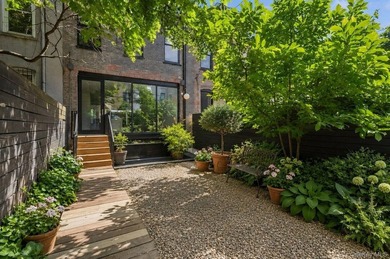 A fully renovated two-family townhouse spanning approximately 3 - photo 7
