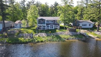 Welcome to this stunning custom-built lakefront home on Secord - photo 2