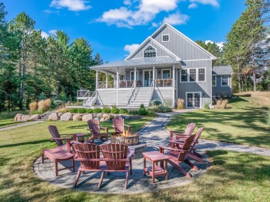 This stunning custom built property provides a tranquil retreat - Lake Home For Sale in Three Lakes, Wisconsin