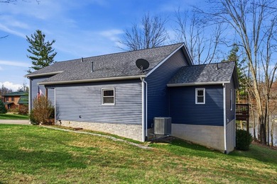 Escape to this impeccably maintained lakefront retreat in the - photo 3