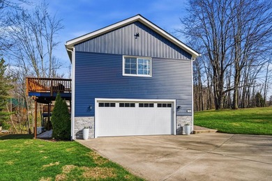 Escape to this impeccably maintained lakefront retreat in the - photo 4