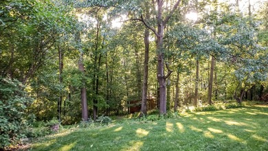 Nestled on a private 1/2 acre wooded lot in the desirable - photo 16