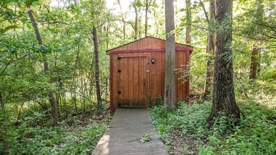 Nestled on a private 1/2 acre wooded lot in the desirable - photo 60