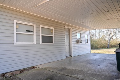 This quaint home sits in the perfect spot! Located just a short