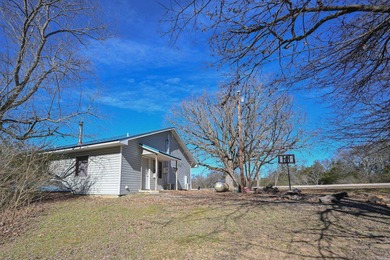 This quaint home sits in the perfect spot! Located just a short