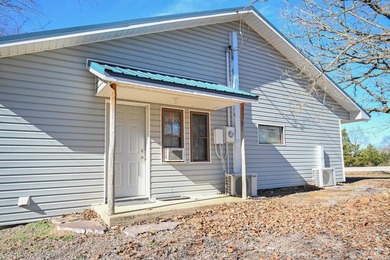 This quaint home sits in the perfect spot! Located just a short