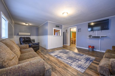 This quaint home sits in the perfect spot! Located just a short