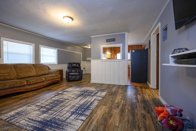 This quaint home sits in the perfect spot! Located just a short