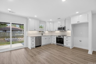 WOW! New Construction! Very pretty white siding w/white brick! - photo 7
