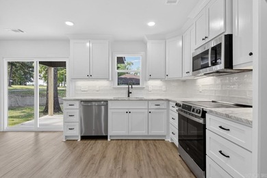 WOW! New Construction! Very pretty white siding w/white brick! - photo 8