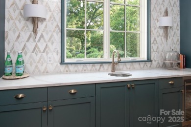 Nestled on nearly half an acre in the heart of prestigious Myers