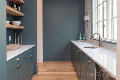 Nestled on nearly half an acre in the heart of prestigious Myers