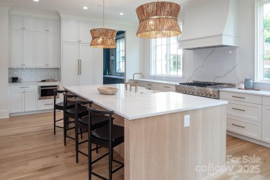 Nestled on nearly half an acre in the heart of prestigious Myers