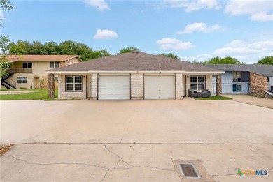 Beautiful rock and brick duplex offering timeless curb appeal - photo 1