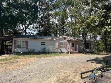 Nestled on 20 beautiful wooded acres, this 3-bedroom, 2-bath - photo 2