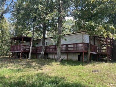 Nestled on 20 beautiful wooded acres, this 3-bedroom, 2-bath - photo 4