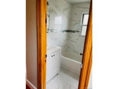 Welcome to this beautifully renovated single-family brick home - photo 5