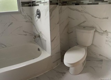 Welcome to this beautifully renovated single-family brick home - photo 8