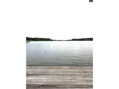 REDUCED! Wooded waterfront lot with dock and septic permit. - photo 2