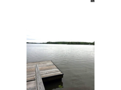 REDUCED! Wooded waterfront lot with dock and septic permit. - photo 3