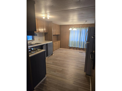 This 2 bedroom, 1 bathroom home offers practical living with a