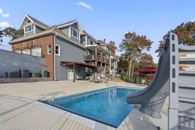 Welcome to an extraordinary lakefront estate in the prestigious - photo 9