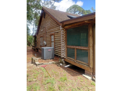This 2-bedroom, 2-bathroom log cabin offers rustic charm. It is - photo 8